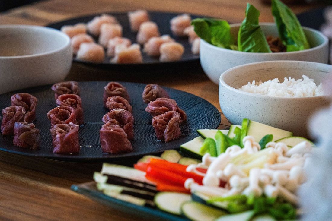 A shared hot pot dinner spread