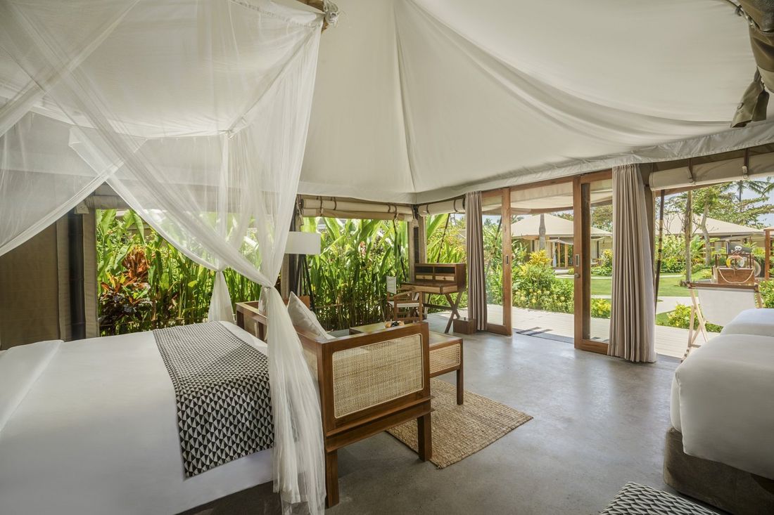 Inside a garden-view glamping tent