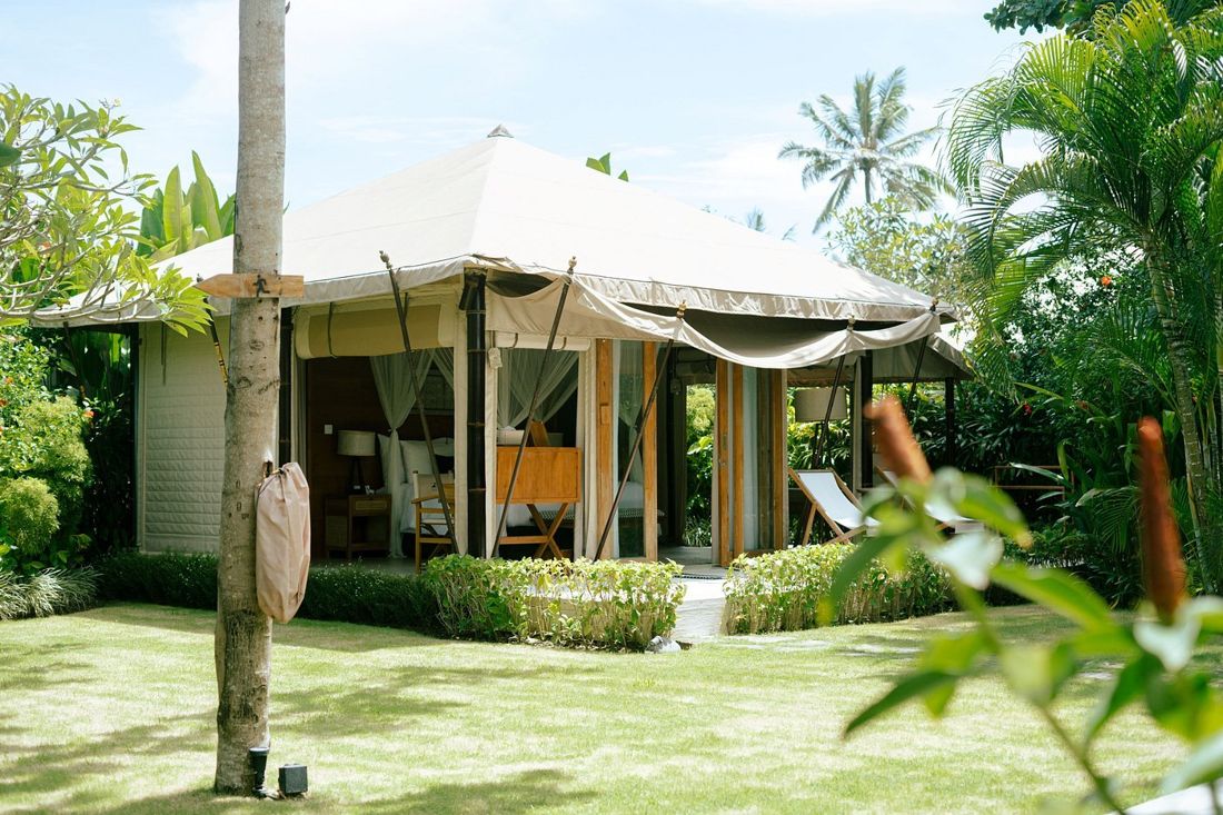 A glamping tent among the palms