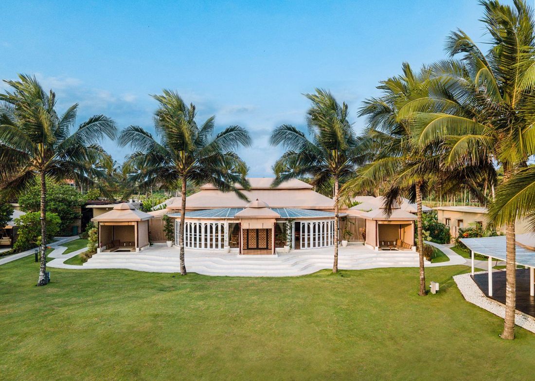 The main pavilion and lawn under the palms