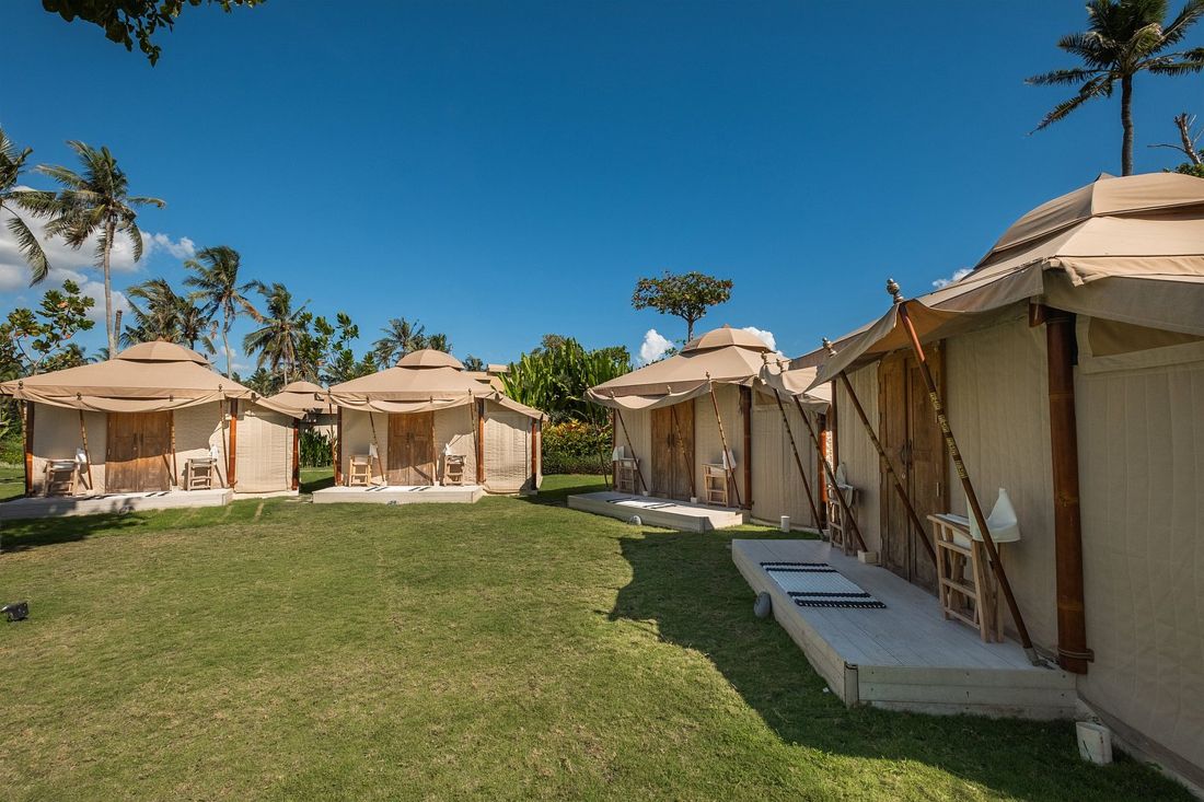 Glamping tents around the garden lawn