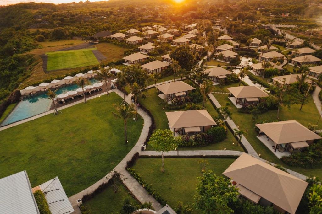 Aerial view of the tents and pool at sunrise