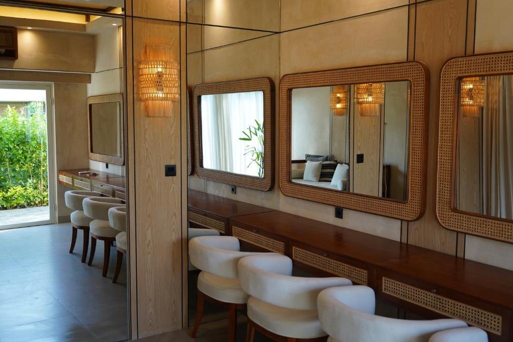 The vanity room with rattan mirrors